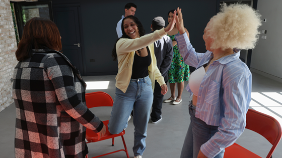 Two women high fiving