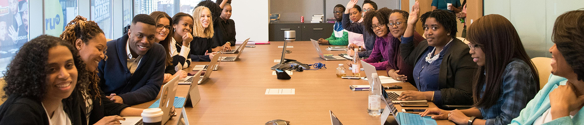 Group of team members around the meeting table